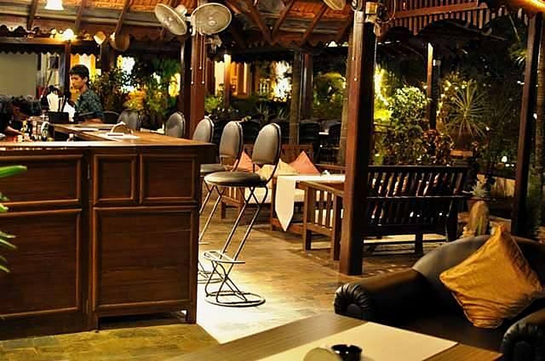 The bar and open-air seating at night